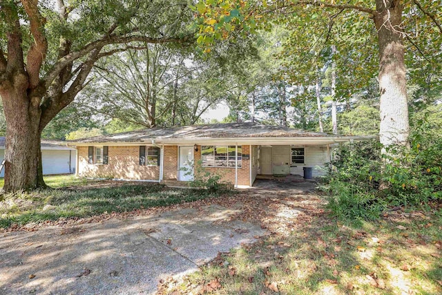 single story home featuring a carport