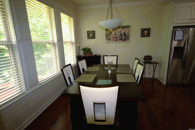 dining room featuring dark hardwood / wood-style floors and ornamental molding