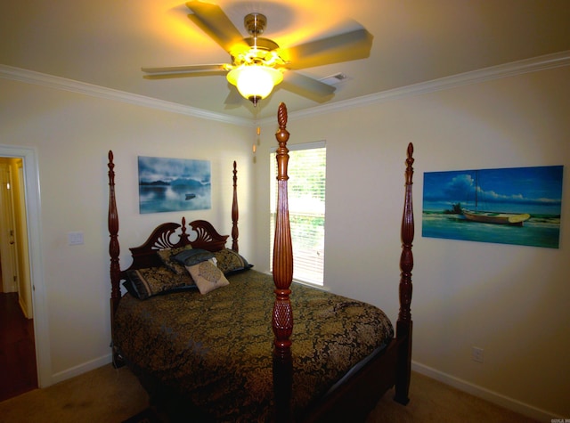 carpeted bedroom with ceiling fan and ornamental molding