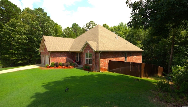 view of front of house with a garage and a front yard