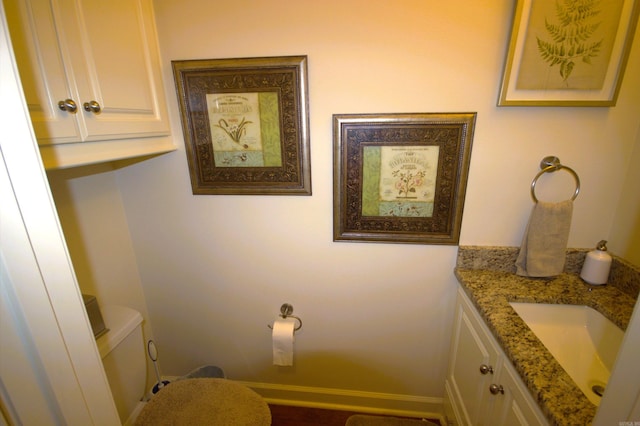 bathroom with vanity and toilet