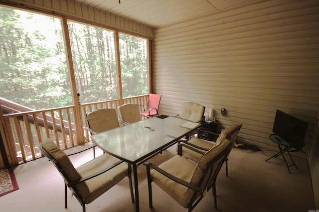 dining space with wooden walls