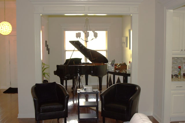 living area featuring a chandelier and wood-type flooring