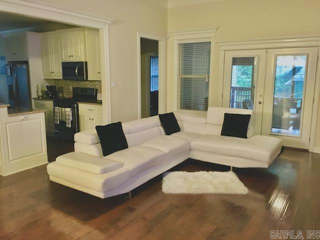 living room with french doors and dark hardwood / wood-style floors