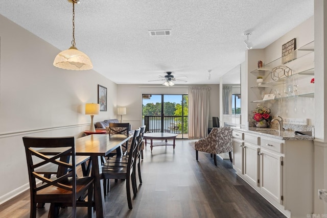 5371 Central Ave Unit L, Hot Springs, AR 71913 - dining area with dark hardwood / wood-style floors, ceiling fan, and a textured ceiling