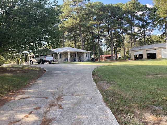 view of front of house with a front lawn and a carport