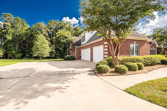 view of side of home featuring a garage