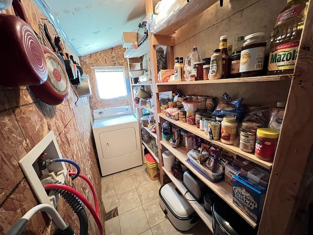 laundry area with light tile patterned floors and washer / clothes dryer