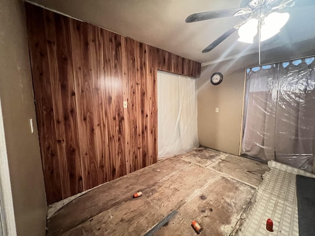 spare room with wood walls