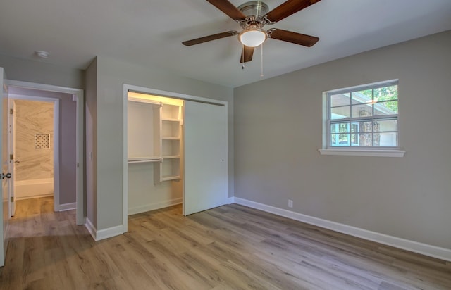 unfurnished bedroom featuring ceiling fan, light hardwood / wood-style floors, and a closet