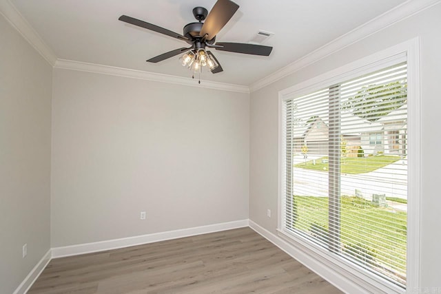 unfurnished room featuring ceiling fan, light hardwood / wood-style flooring, and ornamental molding