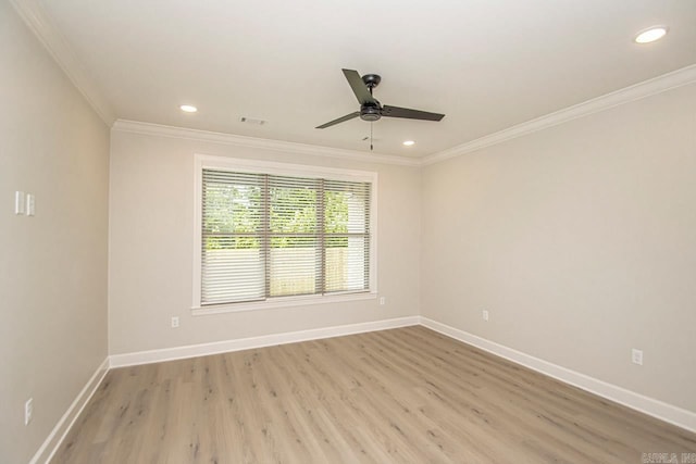 empty room featuring ceiling fan, ornamental molding, and light hardwood / wood-style flooring