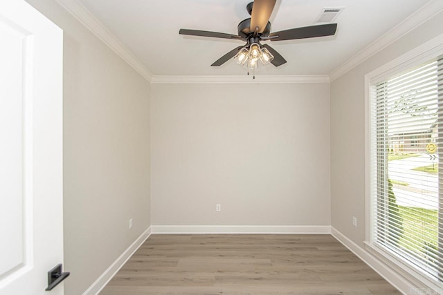 spare room featuring light hardwood / wood-style floors, ceiling fan, and crown molding