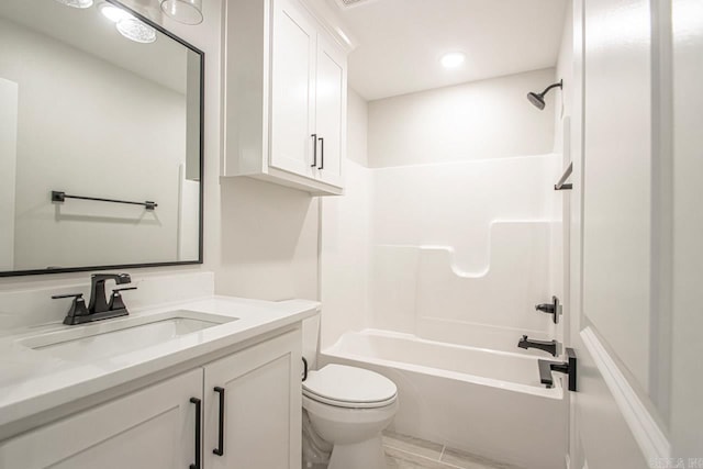 full bathroom featuring shower / tub combination, vanity, and toilet