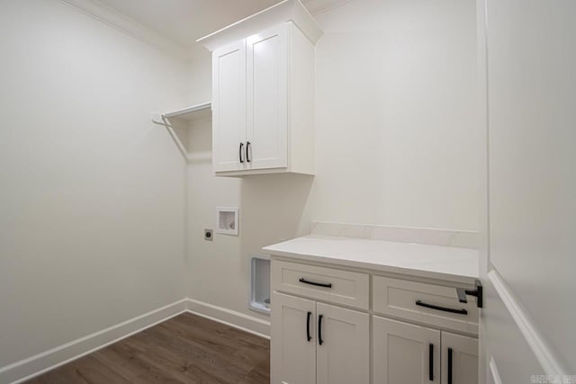 clothes washing area featuring cabinets, hookup for an electric dryer, dark hardwood / wood-style floors, crown molding, and hookup for a washing machine