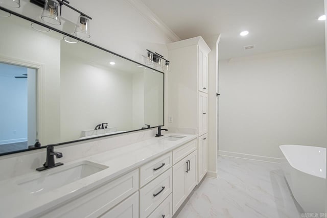 bathroom featuring vanity, a bath, and ornamental molding