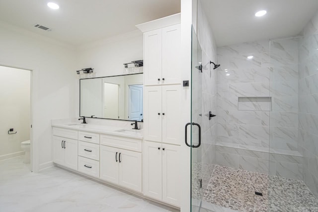 bathroom featuring crown molding, vanity, an enclosed shower, and toilet