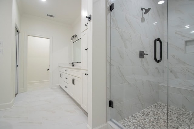 bathroom featuring vanity and an enclosed shower