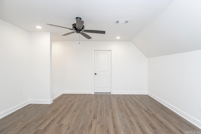 bonus room featuring wood-type flooring, vaulted ceiling, and ceiling fan