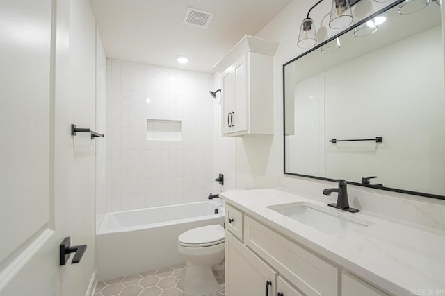 full bathroom with tile patterned flooring, vanity, toilet, and tiled shower / bath