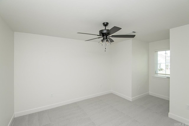 carpeted empty room featuring ceiling fan