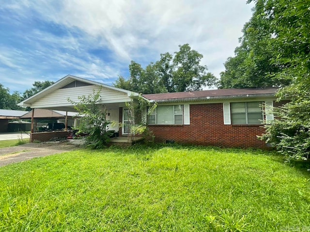 single story home featuring a front yard and a carport