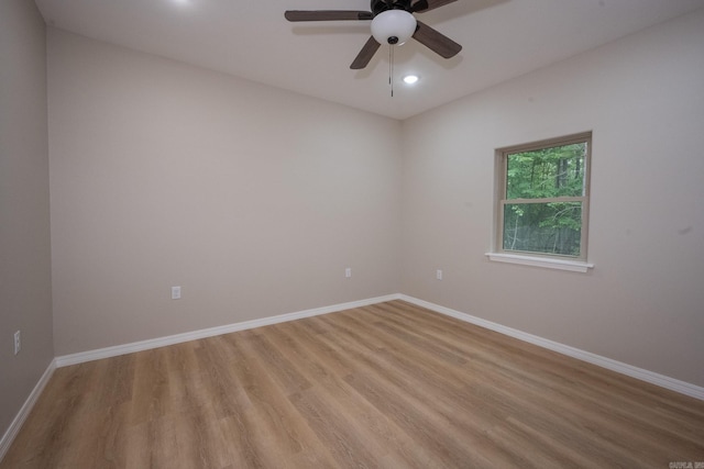 unfurnished room featuring ceiling fan and light hardwood / wood-style floors