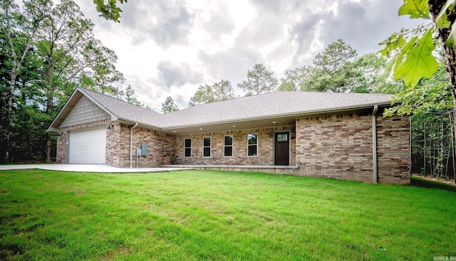 single story home with a front yard and a garage