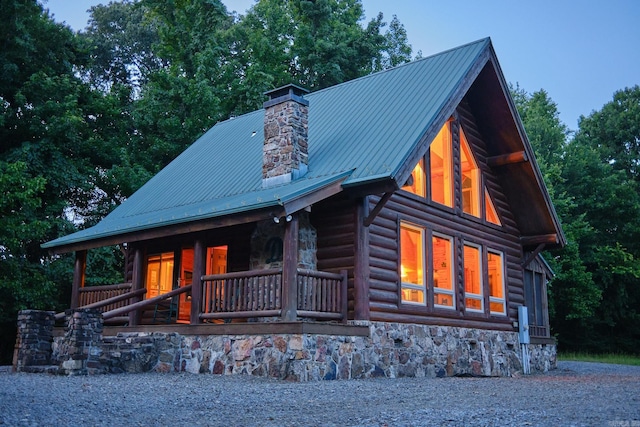 log cabin with a porch