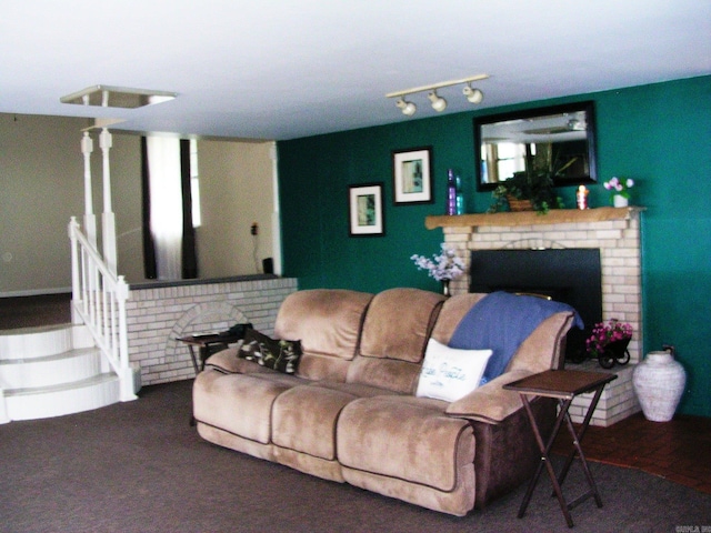 carpeted living room featuring a brick fireplace