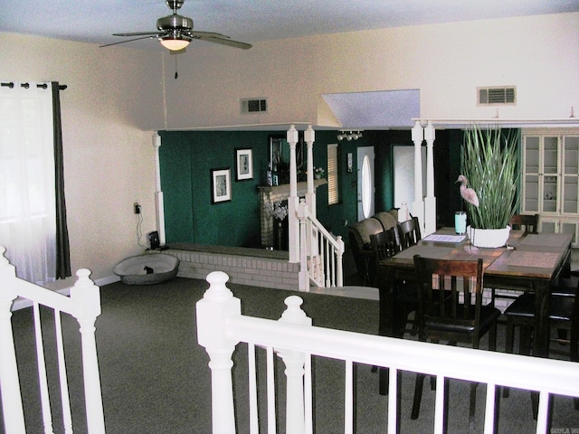 interior space featuring a fireplace and ceiling fan