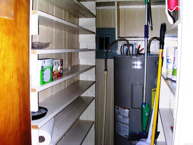 utility room featuring water heater