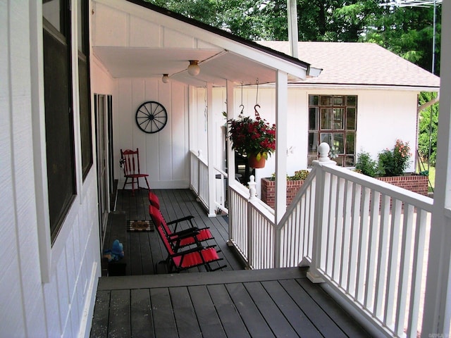 wooden terrace with a porch