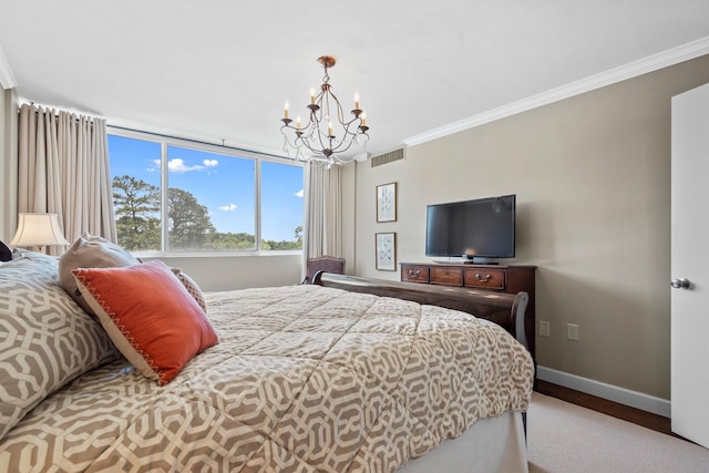 bedroom featuring ornamental molding and an inviting chandelier