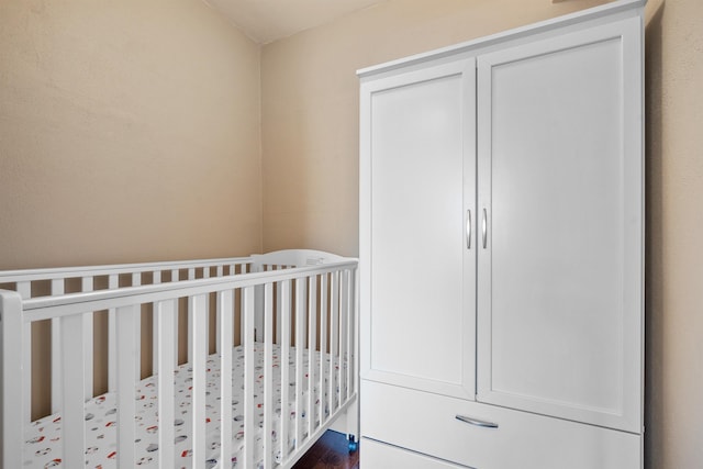 bedroom featuring a nursery area