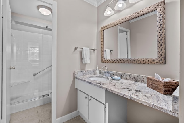 bathroom featuring vanity, a shower with shower door, tile patterned floors, and toilet