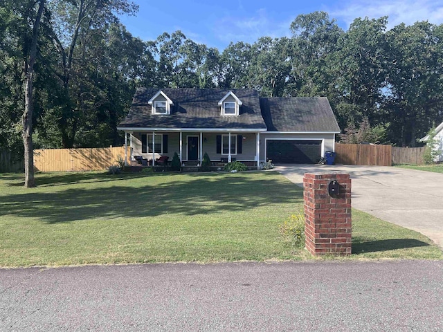 cape cod house featuring a garage, a front yard, and a porch