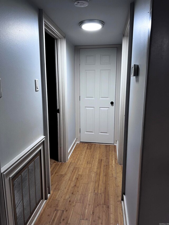 corridor featuring light hardwood / wood-style floors