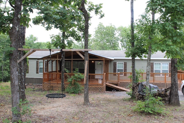 view of front of property featuring a deck