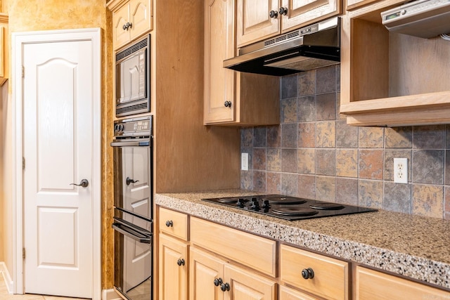 kitchen with light brown cabinets, backsplash, black electric cooktop, and built in microwave