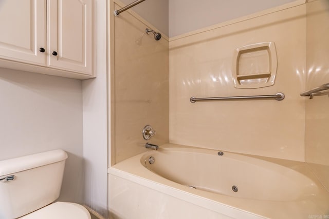 bathroom featuring shower / bath combination and toilet