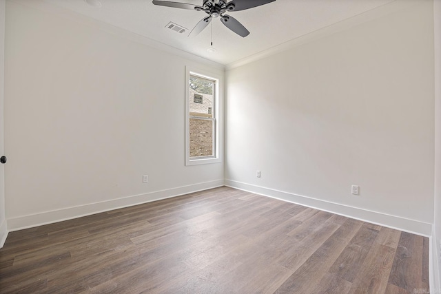 empty room with hardwood / wood-style floors, crown molding, ceiling fan, and a wealth of natural light