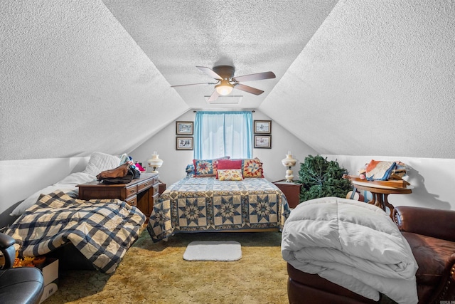 bedroom featuring vaulted ceiling, carpet, a textured ceiling, and ceiling fan