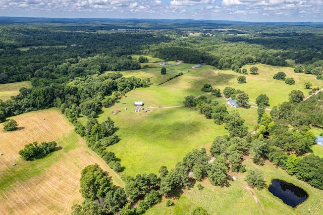 birds eye view of property featuring a water view and a rural view