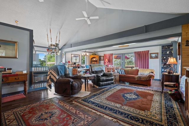 living room with dark wood-type flooring, lofted ceiling, ceiling fan with notable chandelier, and a textured ceiling