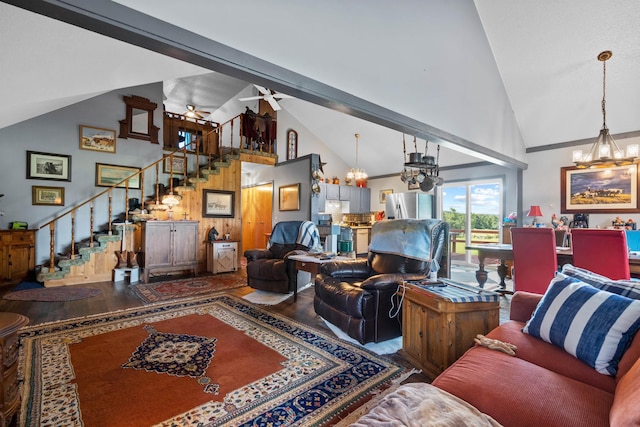 living room with hardwood / wood-style floors, ceiling fan with notable chandelier, high vaulted ceiling, and beamed ceiling