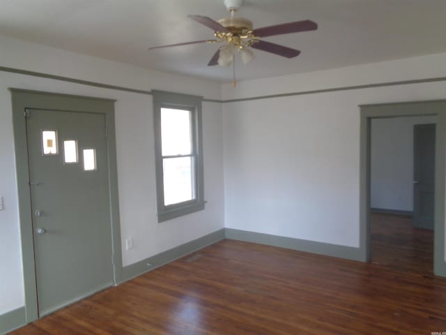 foyer featuring dark hardwood / wood-style flooring and ceiling fan