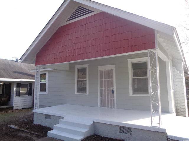 back of house with covered porch