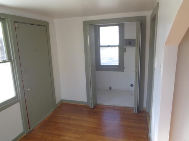 hallway with dark wood-type flooring