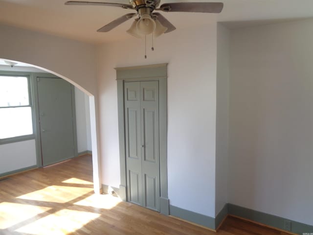 spare room featuring hardwood / wood-style floors and ceiling fan